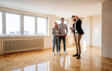 real estate agent shows rental property to couple - rental market as a real estate agent