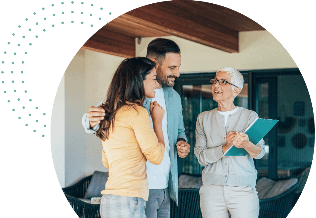 real estate agent working with a California couple after learning the steps to getting their real estate license